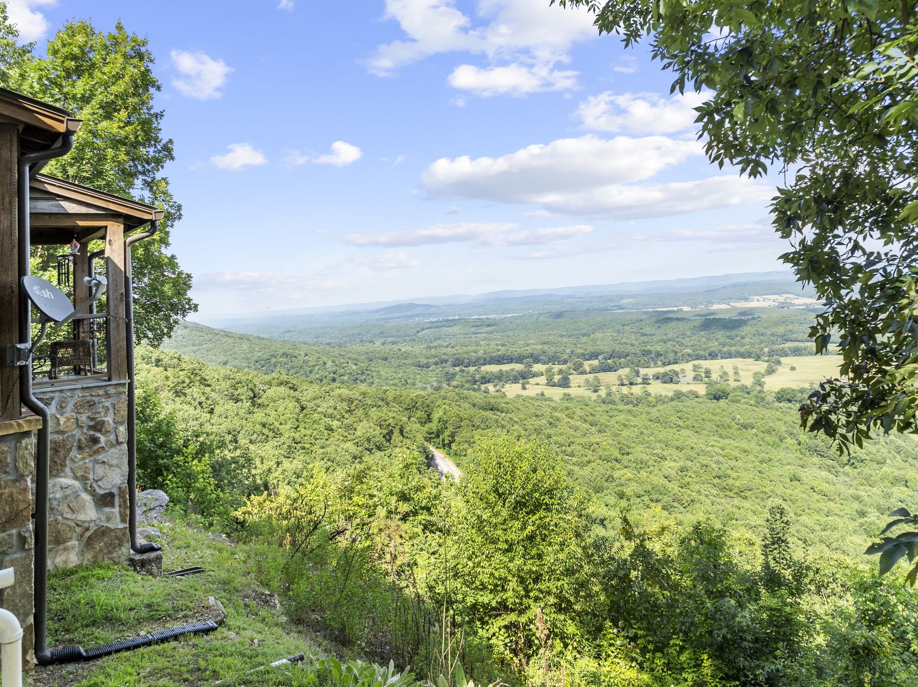 Valley view from the terrace of a ridge-top stone house