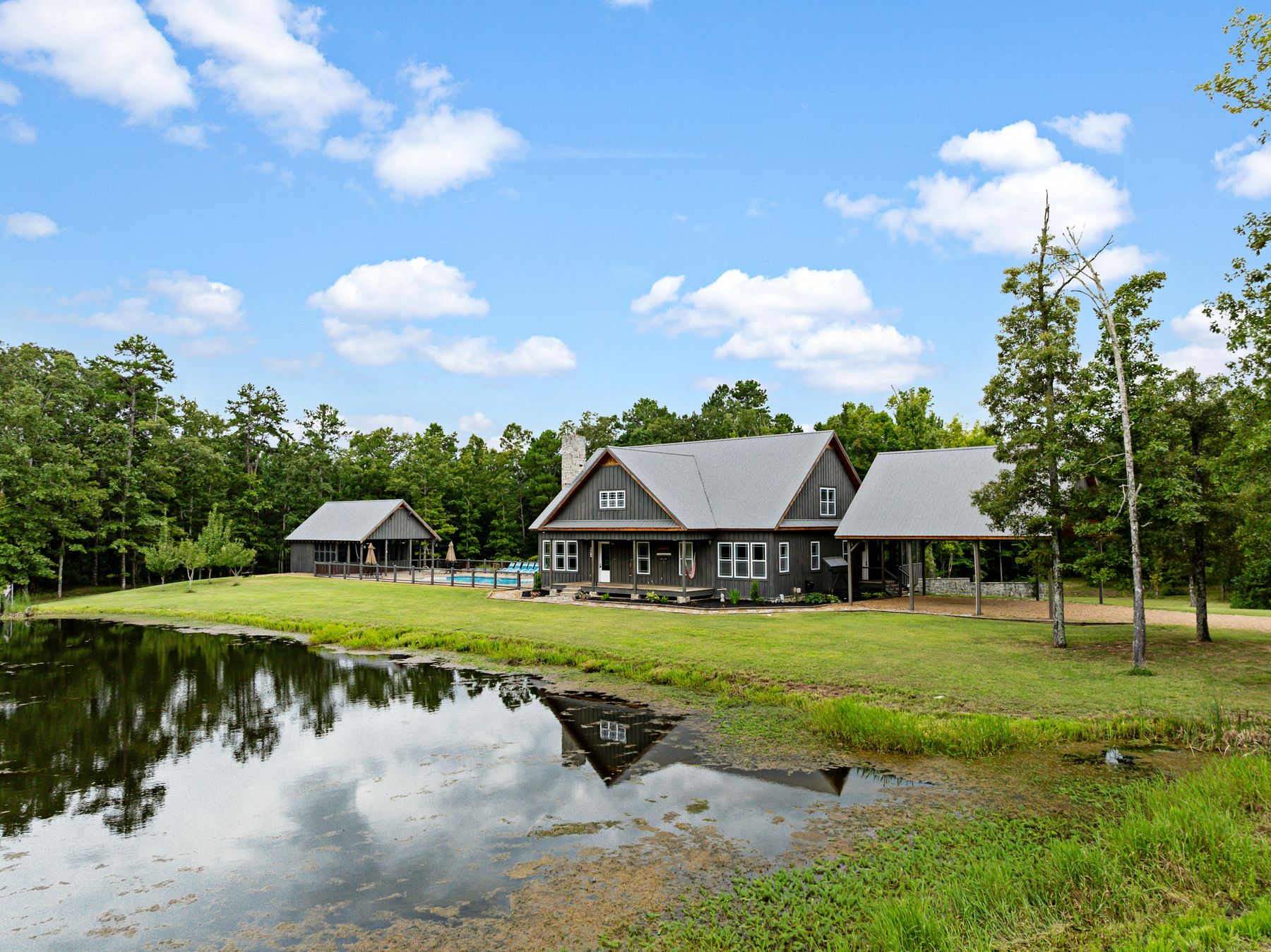 Aerial of a Northwest Georgia home mirrored in its pond