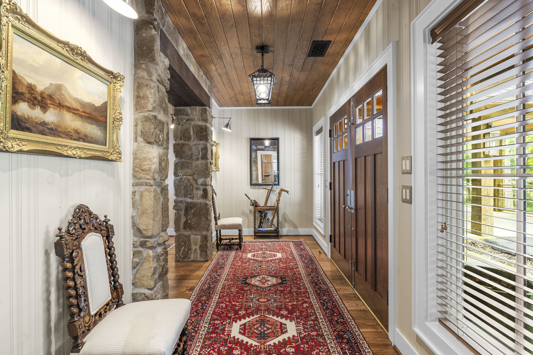 Stone entry hall photographed for a listing